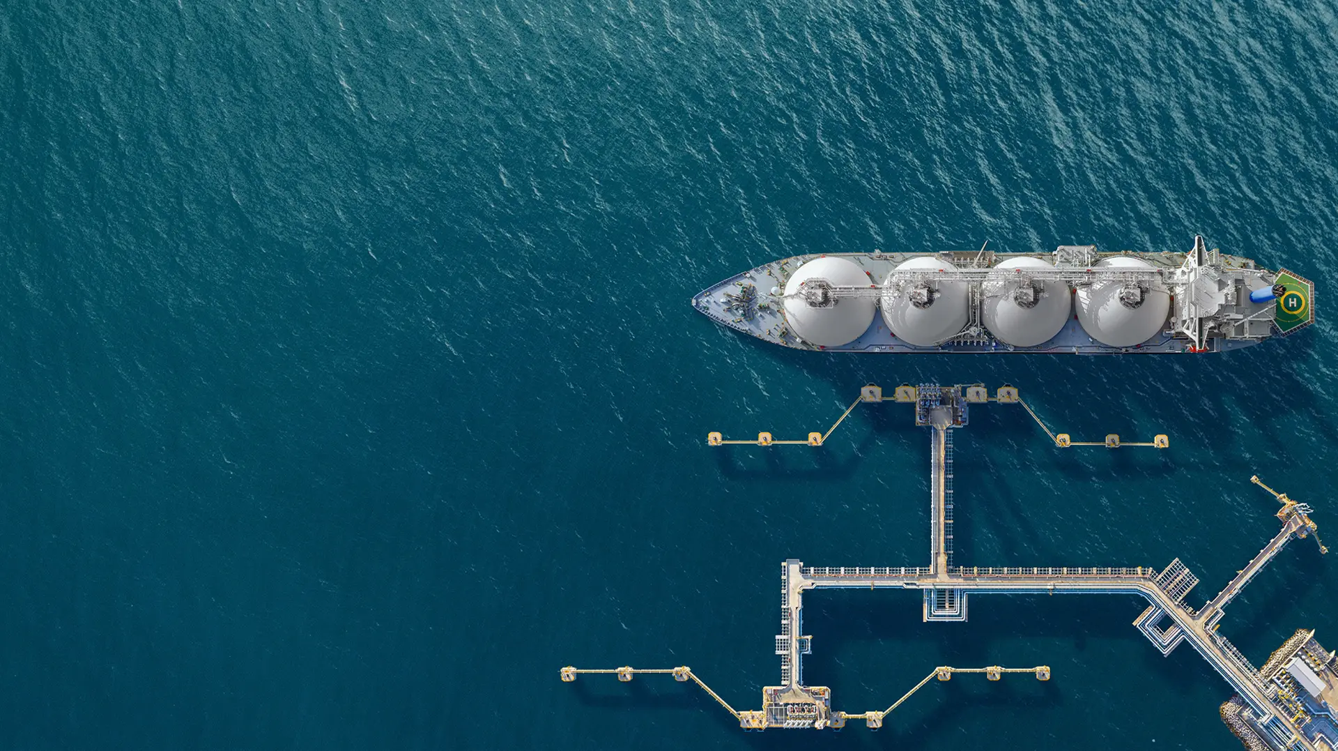 Aerial view of an LNG tanker at a deep-sea terminal